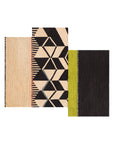 Rustic-Chic tæppe i asymmetrisk design med geometriske mønstre og farveblokke i sort, beige og pistaciegrøn – håndlavet i uld og jute.
